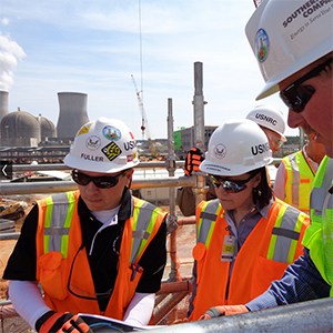 Technicians discuss CMMS work orders for building maintenance