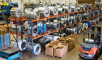 A steel and coil warehouse uses inventory management for better organization.